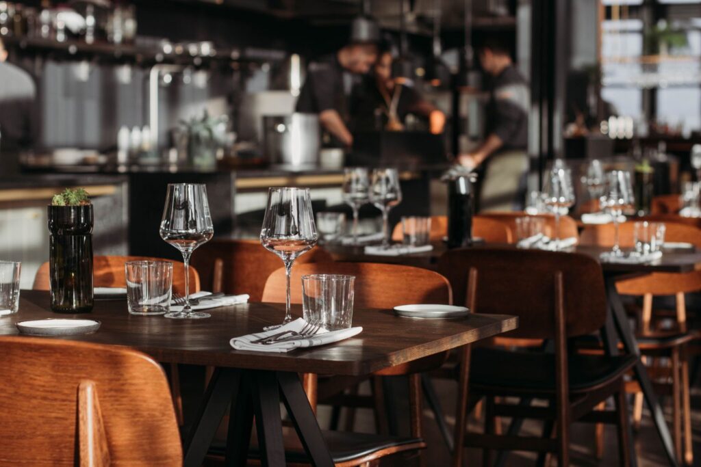 Restaurant dining room with set tables and wine glasses